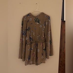 Tan floral romper. Beautiful backless romper perfect for date night!